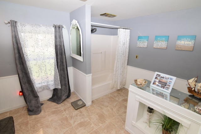 bathroom featuring shower / bath combination with curtain