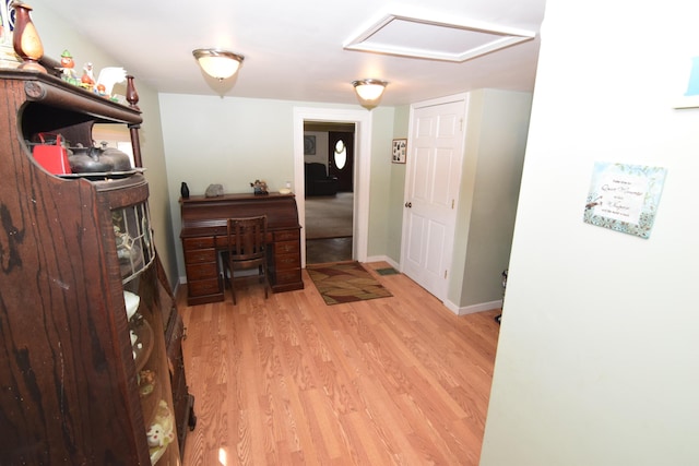 entryway with baseboards and light wood-style flooring