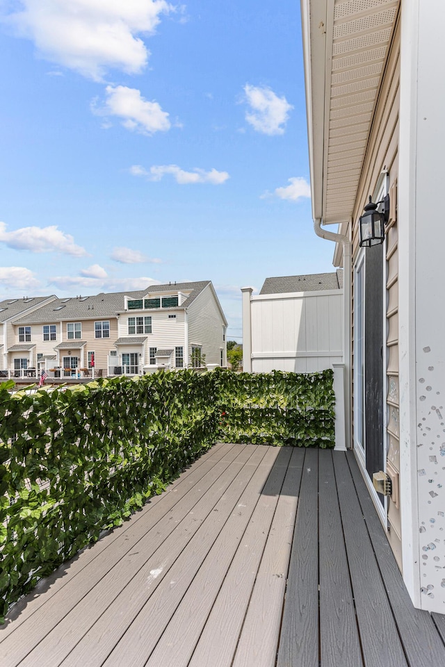wooden terrace with a residential view
