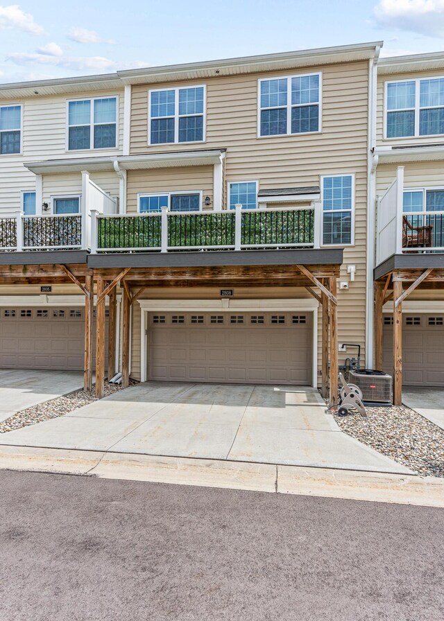 townhome / multi-family property with an attached garage