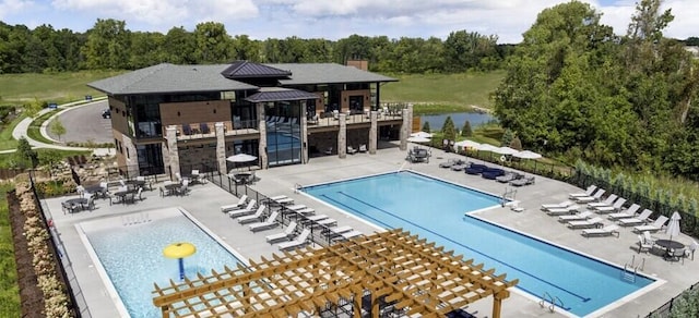 2808 Rathmore Ln, Ann Arbor, MI 48105 - community pool featuring a pergola, a patio area, fence, and a water view