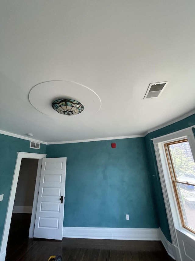 658 W Forest Ave, Detroit, MI 48201 - unfurnished room with dark wood finished floors, baseboards, and visible vents