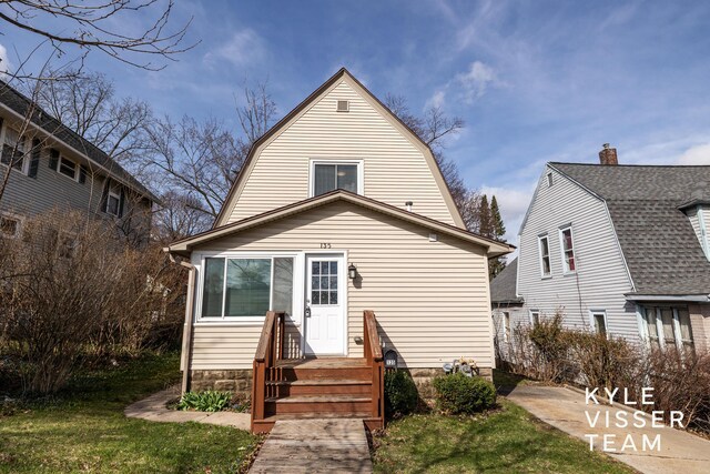 135 Houseman Ave NE, Grand Rapids, MI 49503 - back of house featuring a gambrel roof