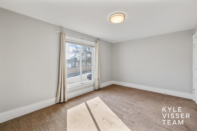 135 Houseman Ave NE, Grand Rapids, MI 49503 - carpeted spare room with baseboards
