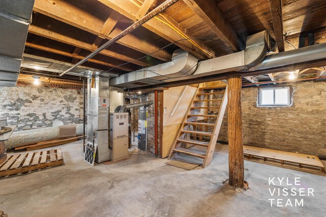 135 Houseman Ave NE, Grand Rapids, MI 49503 - basement featuring water heater and stairway
