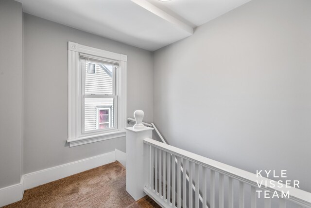 135 Houseman Ave NE, Grand Rapids, MI 49503 - interior space with carpet flooring, an upstairs landing, and baseboards
