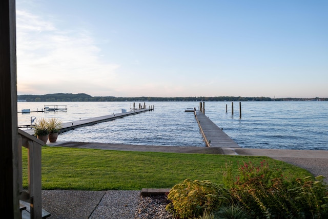 1761 S Shore Dr, Holland, MI 49423 - dock area featuring a lawn and a water view