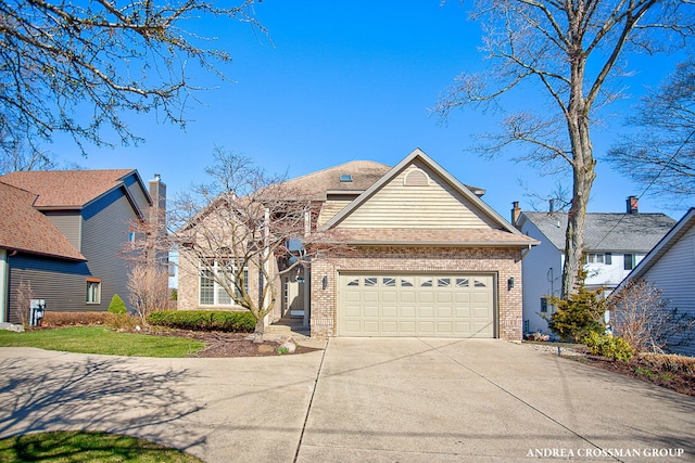 1761 S Shore Dr, Holland, MI 49423 - view of front of home with brick siding, concrete driveway, roof with shingles, and an attached garage