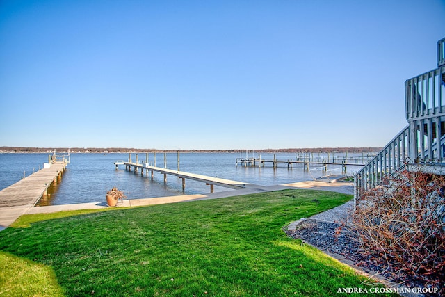 1761 S Shore Dr, Holland, MI 49423 - dock area featuring stairs, a water view, and a yard