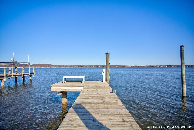 1761 S Shore Dr, Holland, MI 49423 - dock area with boat lift and a water view