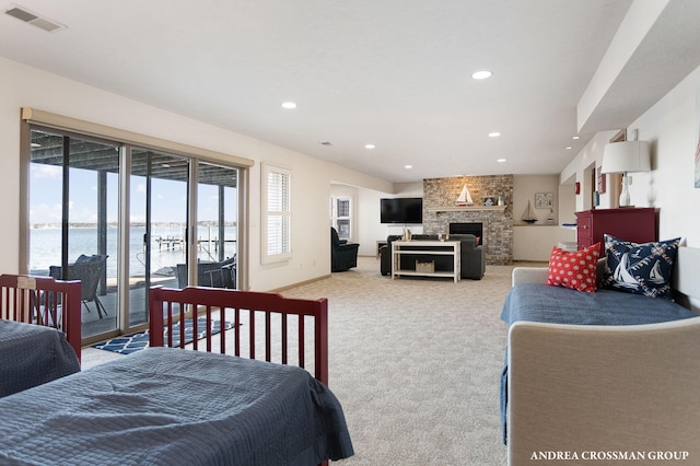 1761 S Shore Dr, Holland, MI 49423 - bedroom with light colored carpet, recessed lighting, a water view, access to outside, and visible vents