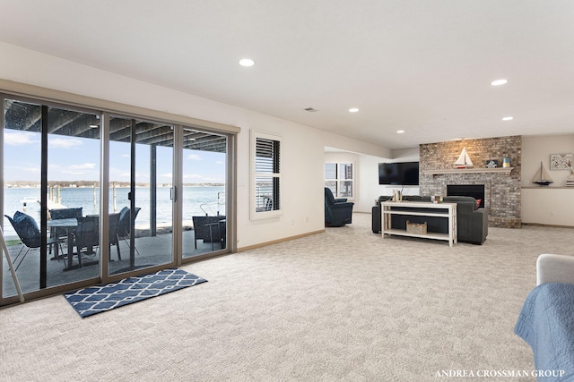 1761 S Shore Dr, Holland, MI 49423 - living area featuring carpet floors, a water view, and recessed lighting