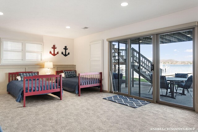 1761 S Shore Dr, Holland, MI 49423 - carpeted bedroom with multiple windows, access to exterior, and recessed lighting