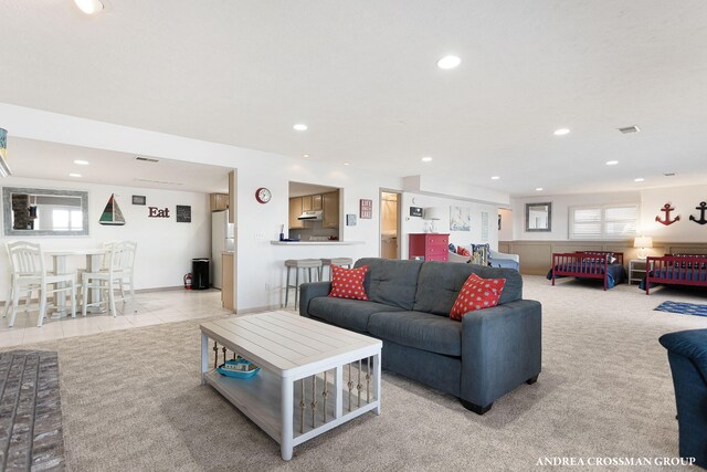 1761 S Shore Dr, Holland, MI 49423 - tiled living area featuring visible vents, plenty of natural light, carpet, and recessed lighting