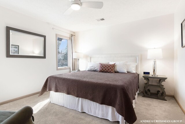 1761 S Shore Dr, Holland, MI 49423 - carpeted bedroom featuring baseboards, ceiling fan, and visible vents