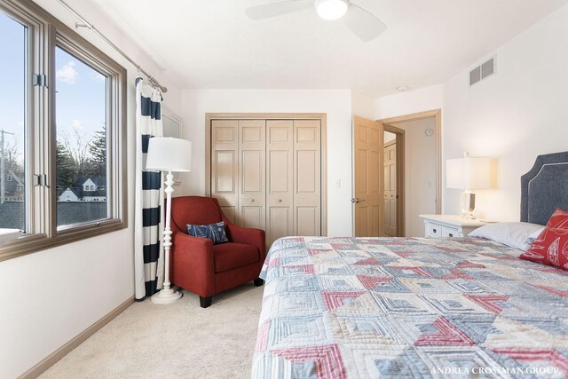 1761 S Shore Dr, Holland, MI 49423 - bedroom featuring a closet, a ceiling fan, light carpet, baseboards, and visible vents
