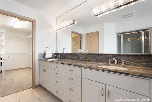 1761 S Shore Dr, Holland, MI 49423 - full bathroom featuring tile patterned floors, a sink, double vanity, and visible vents