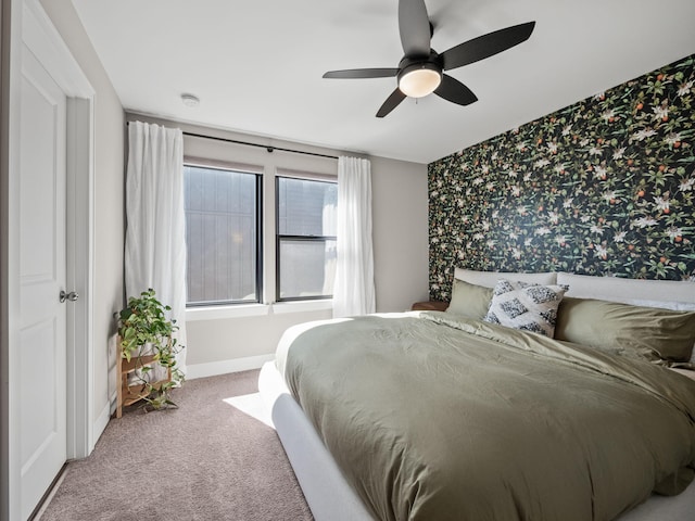 bedroom featuring baseboards, carpet flooring, ceiling fan, and wallpapered walls