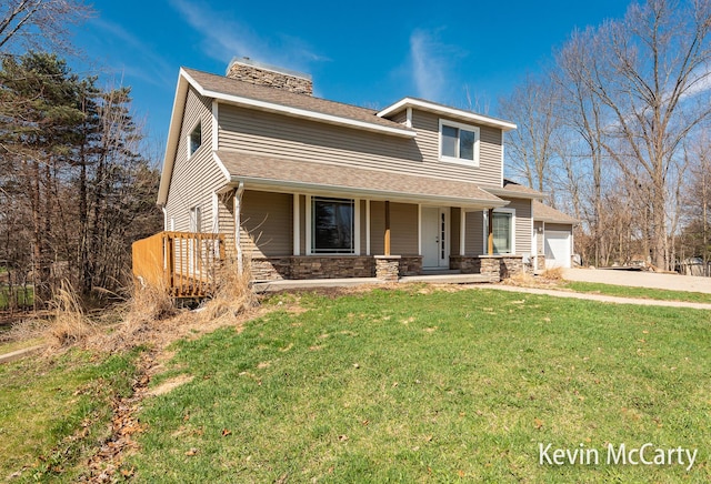 view of front facade with stone siding, concrete driveway, a chimney, a front lawn, and a porch
