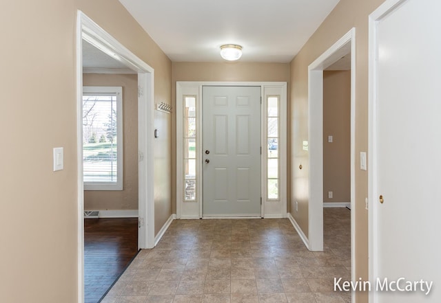 entrance foyer featuring baseboards