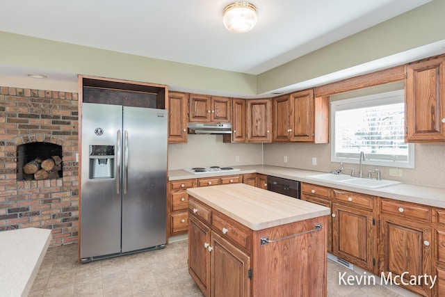 kitchen with white electric cooktop, a sink, stainless steel fridge with ice dispenser, dishwasher, and under cabinet range hood