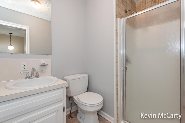 full bath featuring a stall shower, tile patterned floors, toilet, and vanity