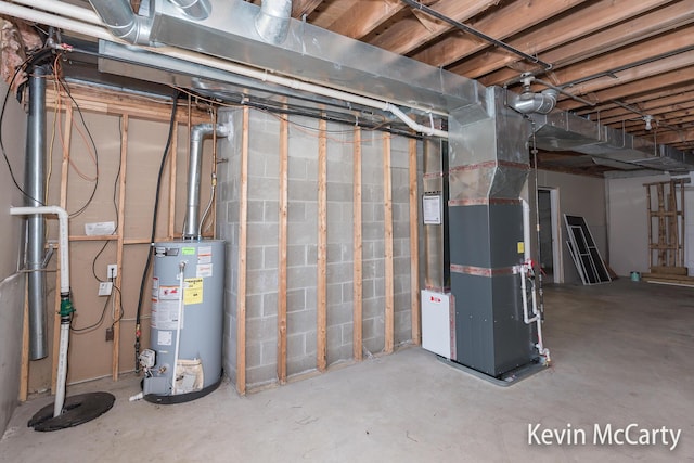 unfinished basement featuring heating unit and gas water heater