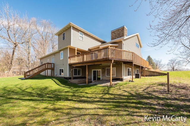 rear view of house featuring a wooden deck, a lawn, central AC unit, and a chimney