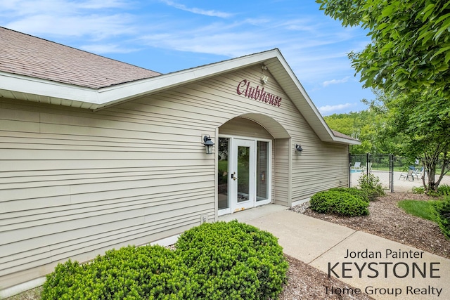 8378 S Jasonville Ct SE Unit 58, Caledonia, MI 49316 - entrance to property with roof with shingles and french doors