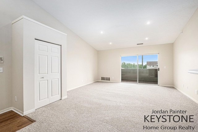 8378 S Jasonville Ct SE Unit 58, Caledonia, MI 49316 - unfurnished bedroom featuring access to outside, carpet floors, baseboards, and recessed lighting