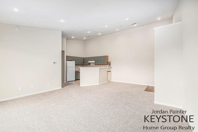 8378 S Jasonville Ct SE Unit 58, Caledonia, MI 49316 - unfurnished living room with recessed lighting, light carpet, and baseboards