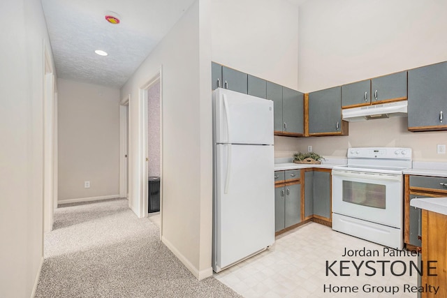 8378 S Jasonville Ct SE Unit 58, Caledonia, MI 49316 - kitchen featuring white appliances, under cabinet range hood, light countertops, baseboards, and recessed lighting