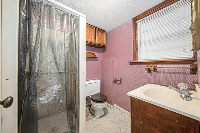 121 Wilkinson St, Chelsea, MI 48118 - full bathroom featuring a shower stall, a textured ceiling, toilet, marble finish floor, and baseboards