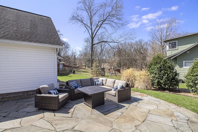 view of patio with outdoor lounge area and a playground