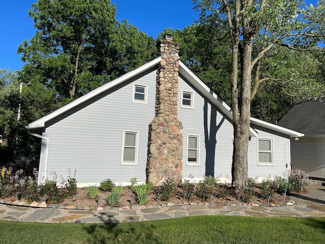 view of home's exterior featuring a chimney