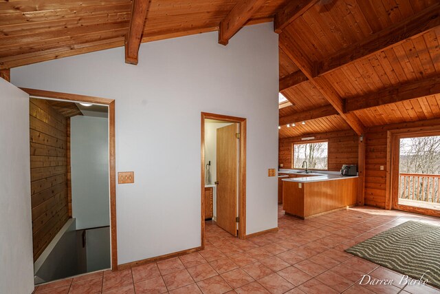 3770 Pine Ln, Saranac, MI 48881 - kitchen featuring a peninsula, wooden ceiling, light tile patterned floors, and light countertops
