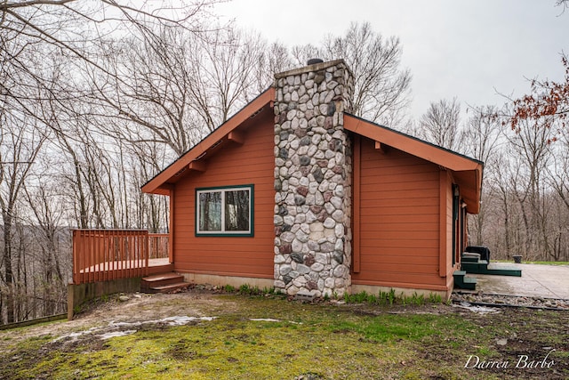 3770 Pine Ln, Saranac, MI 48881 - view of side of property featuring a chimney and a deck