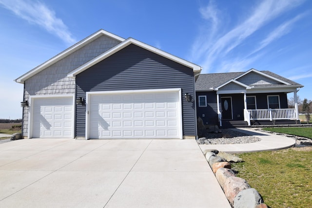 28 Hunting Trail Ave, Quincy, MI 49082 - single story home with covered porch, a garage, and concrete driveway