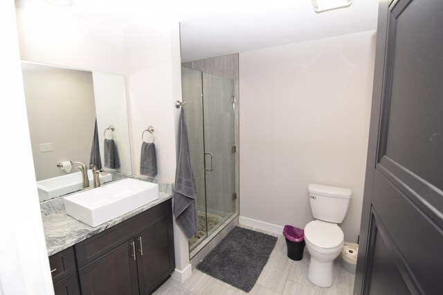 28 Hunting Trail Ave, Quincy, MI 49082 - bathroom featuring a stall shower, baseboards, toilet, and vanity