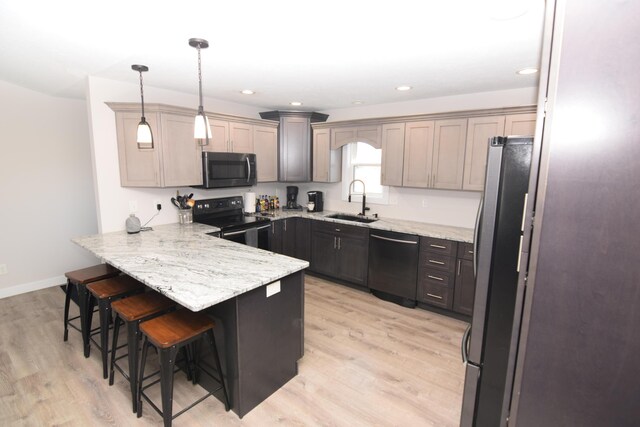 28 Hunting Trail Ave, Quincy, MI 49082 - kitchen featuring a peninsula, dishwasher, a sink, black electric range, and freestanding refrigerator