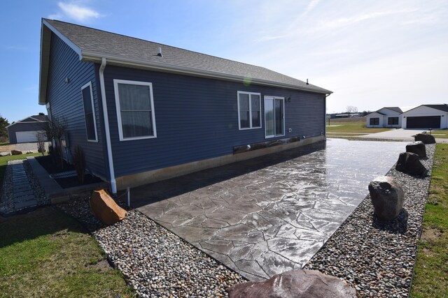 28 Hunting Trail Ave, Quincy, MI 49082 - view of home's exterior featuring a patio area