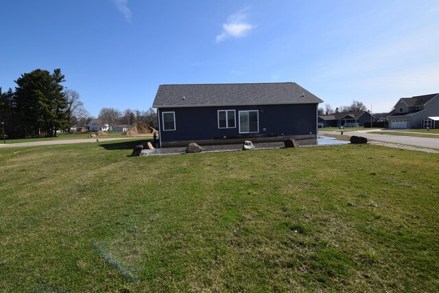 28 Hunting Trail Ave, Quincy, MI 49082 - rear view of property with a lawn