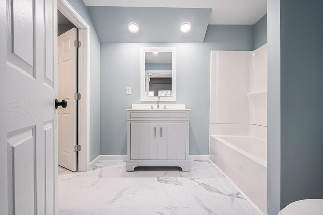 101 E 4th St, Buchanan, MI 49107 - bathroom featuring marble finish floor, baseboards, shower / tub combination, and vanity