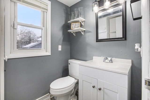 half bathroom featuring toilet and vanity