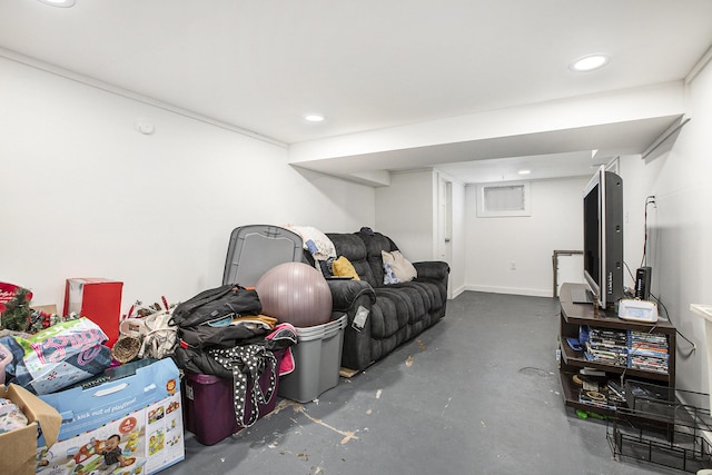 interior space with concrete flooring, baseboards, and recessed lighting