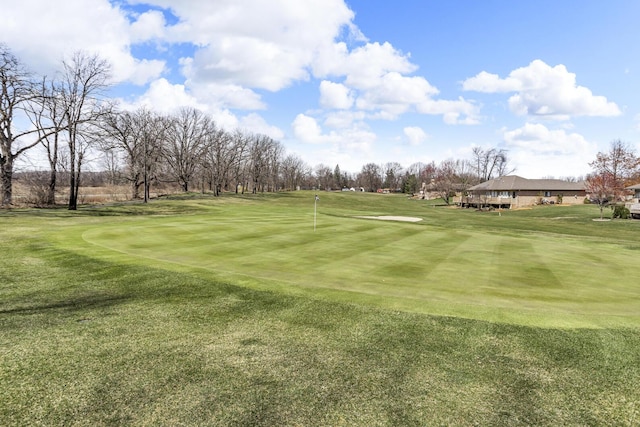 4284 Fairway Ln, Jackson, MI 49201 - view of community featuring golf course view and a lawn