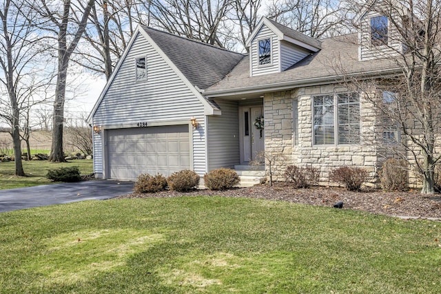 4284 Fairway Ln, Jackson, MI 49201 - new england style home with a front yard, driveway, stone siding, and a shingled roof