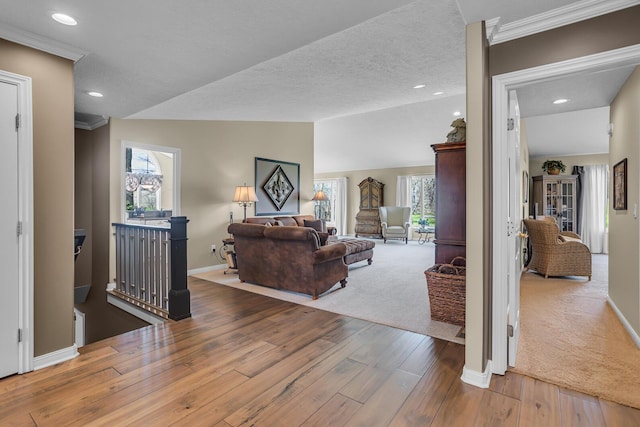 4284 Fairway Ln, Jackson, MI 49201 - living area featuring baseboards, ornamental molding, hardwood / wood-style flooring, recessed lighting, and lofted ceiling