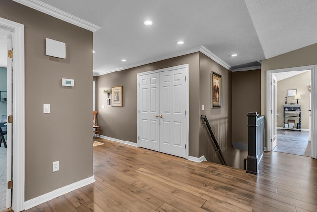 4284 Fairway Ln, Jackson, MI 49201 - hall with baseboards, recessed lighting, an upstairs landing, crown molding, and wood-type flooring