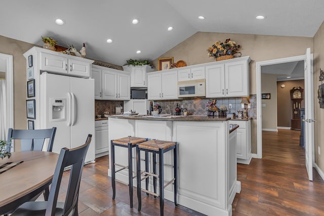 4284 Fairway Ln, Jackson, MI 49201 - kitchen with white cabinetry, a kitchen breakfast bar, and white appliances